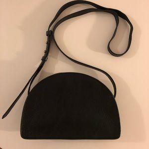 Black crossbody half moon leather bag